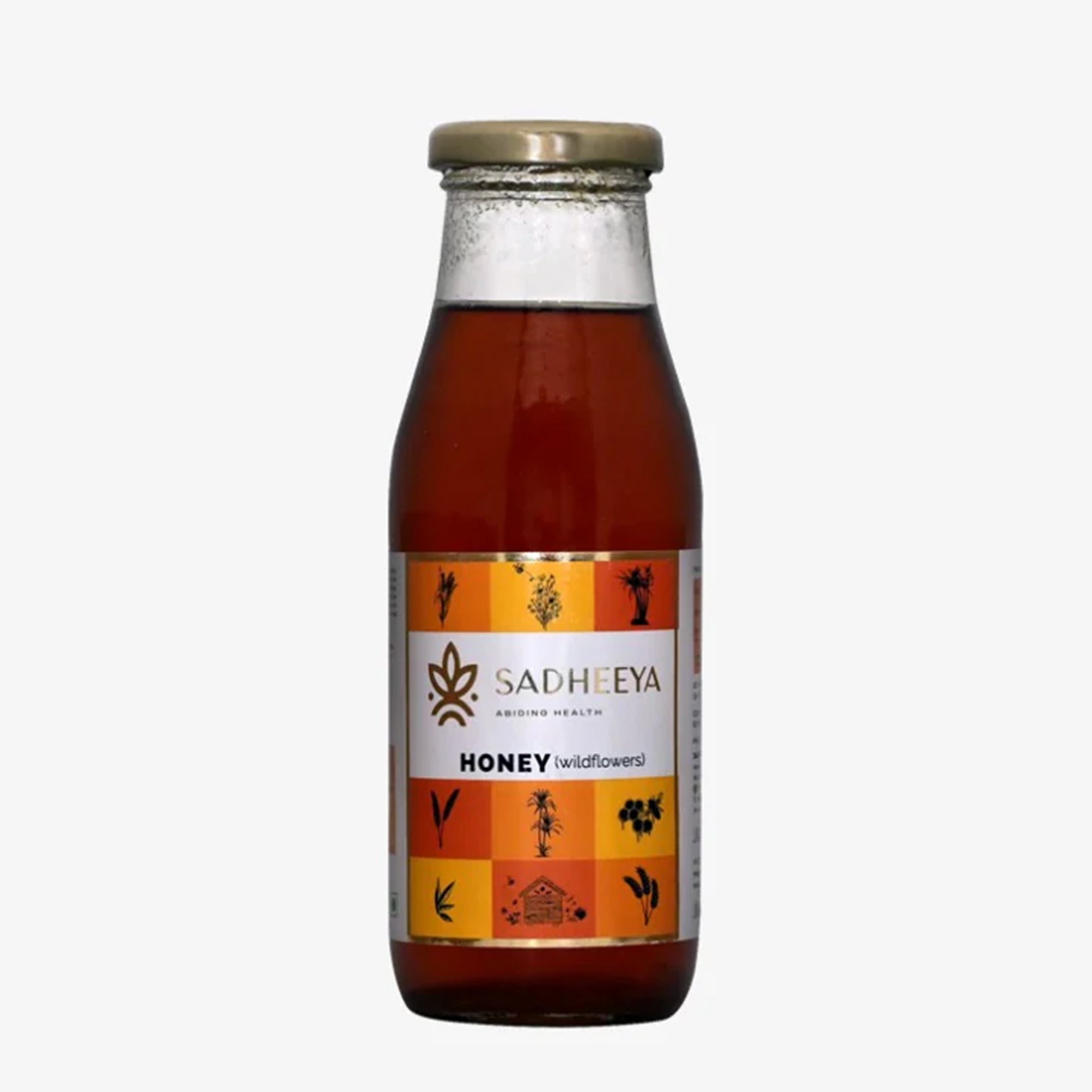 Bottle of Sadheeya honey on a white background