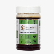 Sadheeya Travancore jaggery in a transparent plastic jar with a white lid and green label, isolated on a white background.